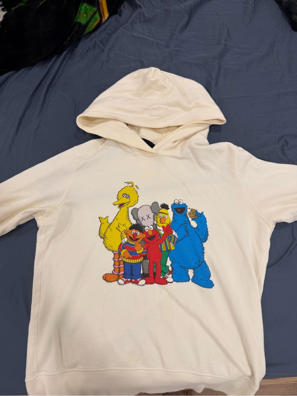 KAWS women Cream Hoodie with Colorful Character Crew Print